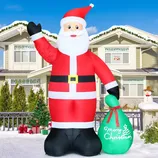 A large inflatable Santa Claus decoration is displayed in front of a house, holding a green sack with \“Merry Christmas\“ written on it.