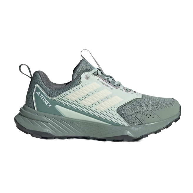 A green Adidas Terrex trail running shoe with mesh upper for breathability, featuring the brand's signature three stripes and a rugged outsole for enhanced traction.