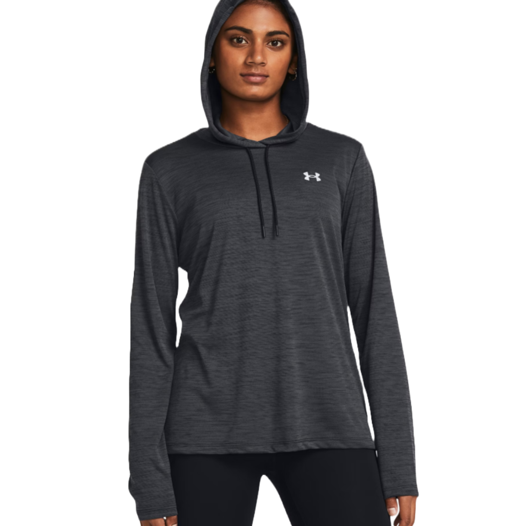 A person is wearing a dark gray Under Armour hoodie with a small logo on the chest, paired with black pants.