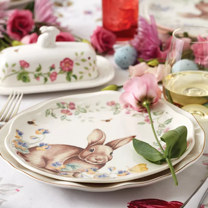Set of 4 Lenox Bunny Accent Plates featuring a whimsical bunny design surrounded by colorful flowers and greenery on a white background, perfect for a spring table setting.