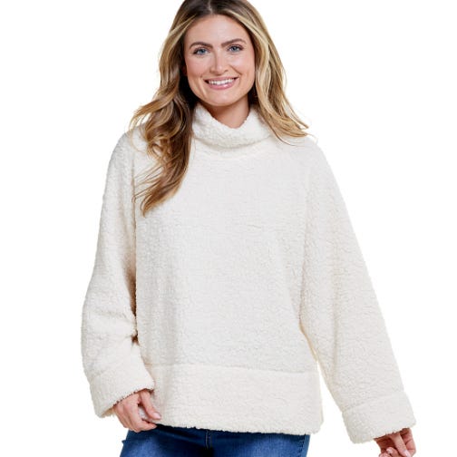 The Architect Mock Neck Polar Sweatshirt is a cozy, plush, cream-colored top with a loose fit and long sleeves, featuring a high collar.
