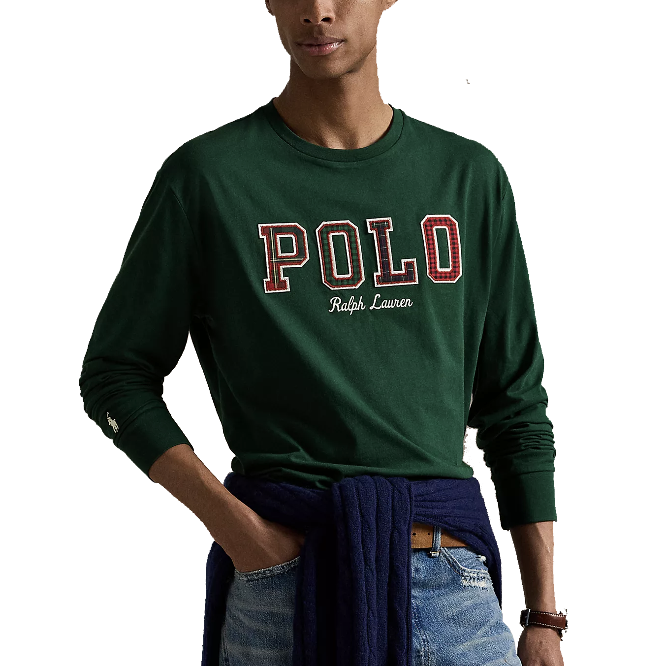 Green long-sleeve shirt with \“POLO Ralph Lauren\“ text in red and white lettering, paired with blue denim jeans. A dark sweater is tied around the waist.