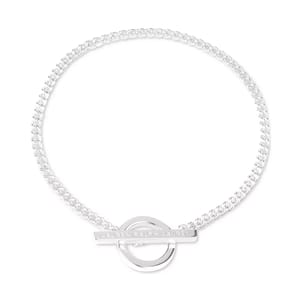 Silver bracelet with a braided design and a circular charm featuring the etched words \“Ralph Lauren.\“