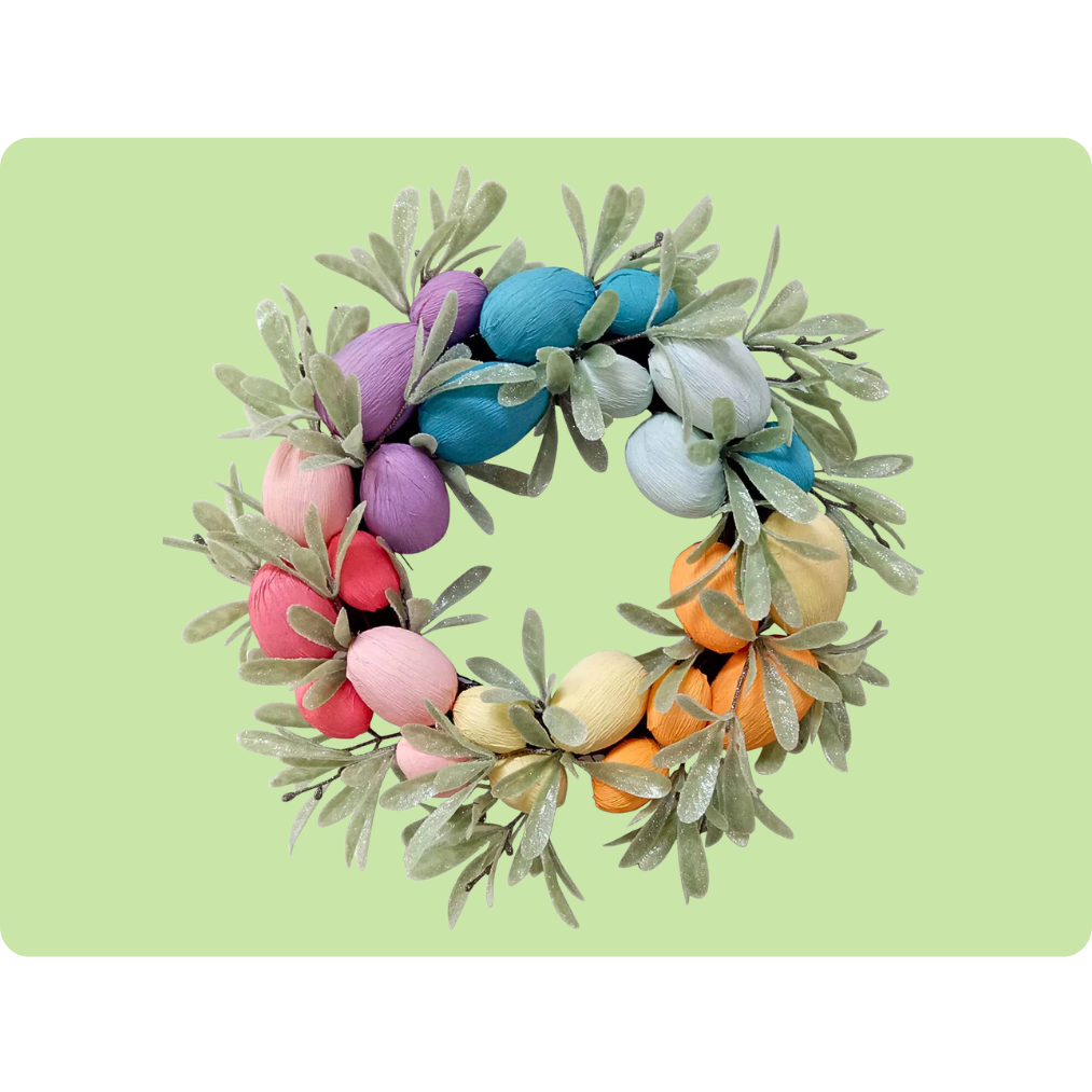A colorful wreath featuring pastel-hued egg-shaped elements and green leaves, set against a light green background, ideal for spring or Easter decorations.