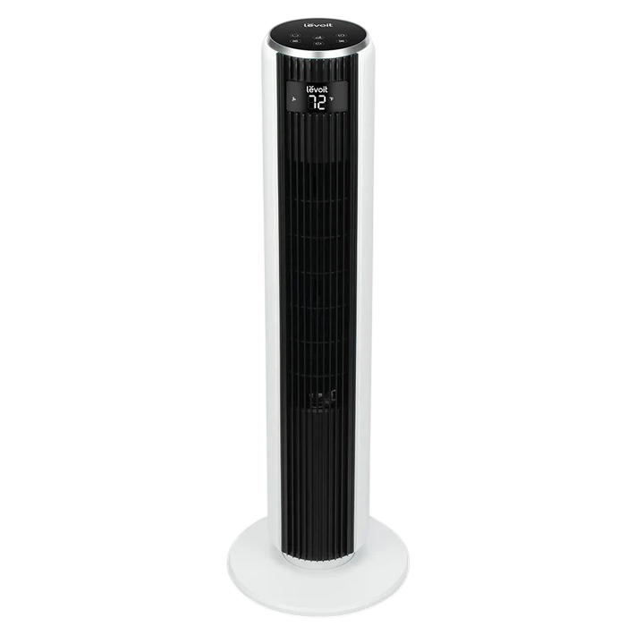 A tall, white Levoit tower fan with a digital display showing the temperature, designed for efficient air circulation.