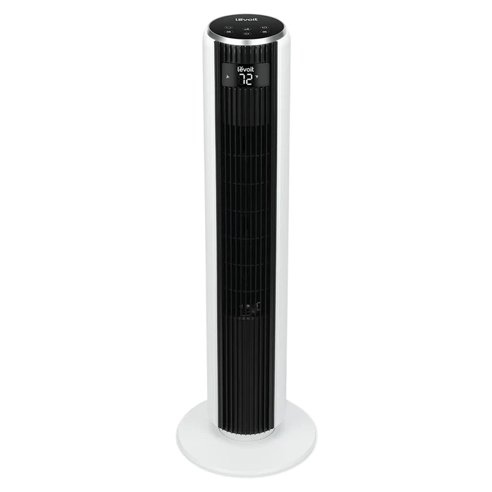 A tall, white Levoit tower fan with a digital display showing the temperature, designed for efficient air circulation.
