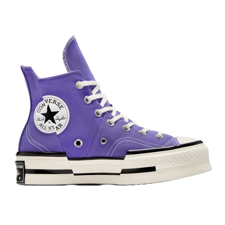 A pair of high-top Converse Chuck Taylor All Star sneakers in purple with classic white soles and laces.