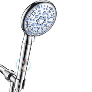 Handheld showerhead with blue nozzles and a built-in filter featuring mineral beads for water purification.