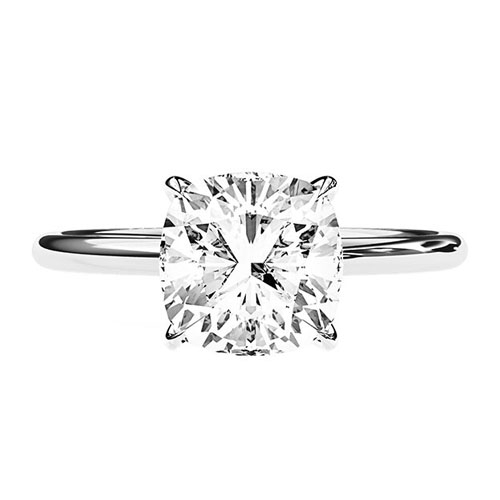 A 3-carat lab-grown diamond engagement ring featuring a cushion-cut diamond set in a four-prong setting on a sleek, polished white gold band.