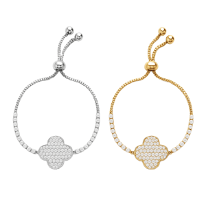Two adjustable bracelets, one in silver and the other in gold, feature a central clover-shaped charm encrusted with clear crystals, connected by a beaded chain.