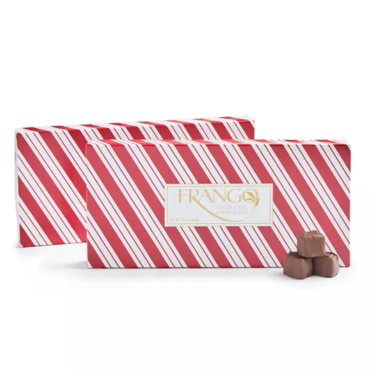 Two boxes of Frango Candy Cane Chocolates are shown, featuring a red and white striped design with three chocolate pieces beside them.