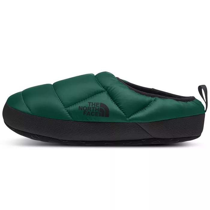 Green slip-on slipper with a quilted design and black sole, featuring \“The North Face\“ logo on the side.