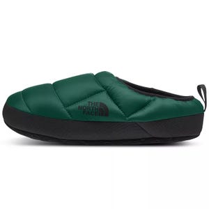 Green slip-on slipper with a quilted design and black sole, featuring \“The North Face\“ logo on the side.