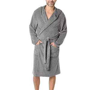 A person is wearing a gray hooded bathrobe with a belt and pockets.
