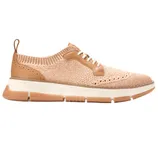 A beige knit sneaker with white laces and a tan leather accent features a cushioned sole with textured tan and white segments.