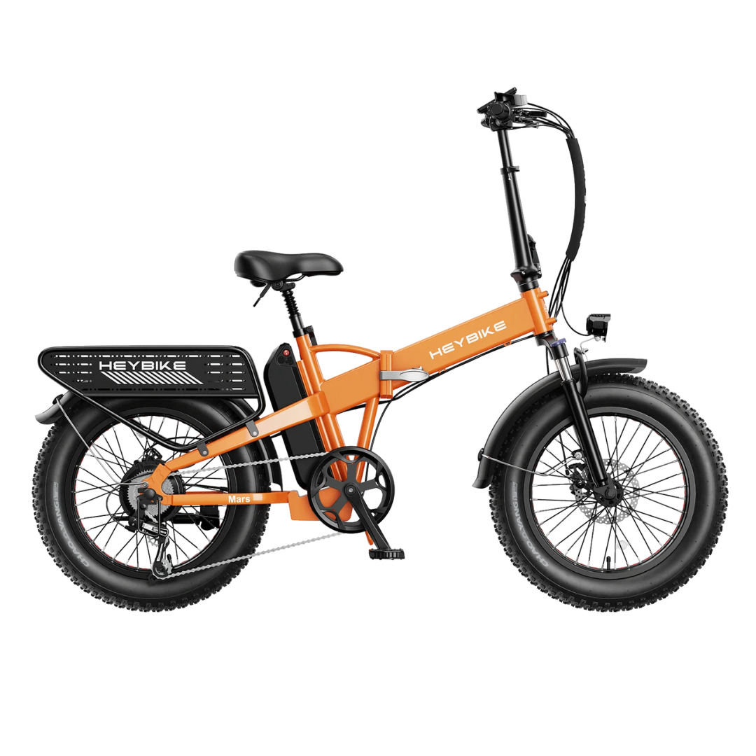 An orange folding electric bicycle with fat tires and a rear cargo rack.