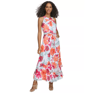 A woman wearing a sleeveless floral dress with a high neckline and tiered skirt. She has on open-toed heels.