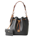 A dark gray bucket bag with tan leather straps and drawstring, featuring a small matching wallet attached by a strap.
