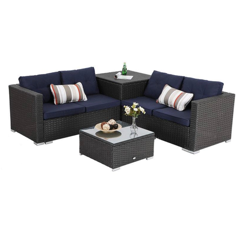 Outdoor patio set with two dark wicker sofas featuring blue cushions and striped pillows, a corner table, and a matching low coffee table topped with a glass surface.