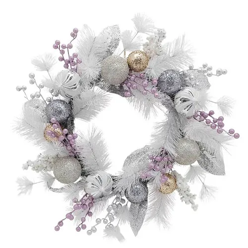 A decorative wreath featuring white feathers, silver and gold glittery ornaments, and clusters of purple and white berries.