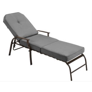 A gray cushioned outdoor chaise lounge with an adjustable backrest and brown metal frame, featuring armrests for added comfort.