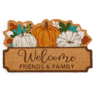 A doormat features the phrase \“Welcome Friends & Family\“ with illustrations of pumpkins and autumn leaves.
