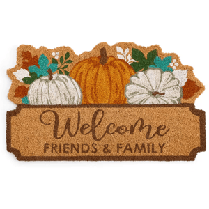 A doormat features the phrase \“Welcome Friends & Family\“ with illustrations of pumpkins and autumn leaves.