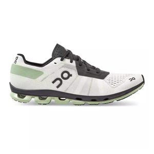 On Running Cloudflash 2 Shoes feature a sleek design with a white and black color scheme, highlighted by a green accent at the heel. They showcase the brand's signature CloudTec cushioning technology for enhanced performance.