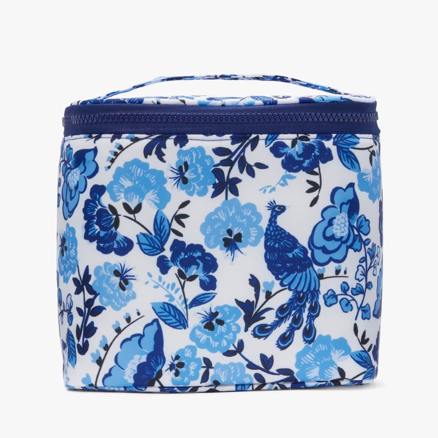 A lunch tote with a floral and peacock design in shades of blue on a white background, featuring a dark blue zipper and trim.