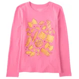 Pink long-sleeve shirt with various types of pasta illustrations, including bow ties, penne, and ravioli, printed in yellow on the front.