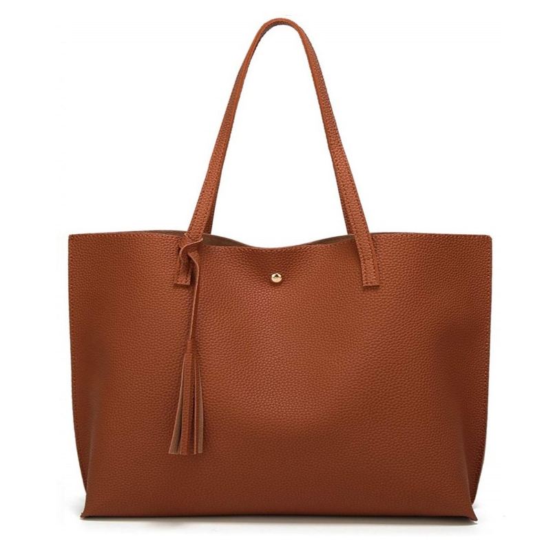 A brown tote bag with a textured surface, featuring two shoulder straps, a tassel detail, and a central button closure.