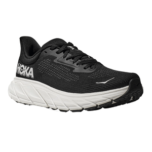 A black Hoka running shoe with a thick white sole, featuring Hoka branding on the side and a lace-up design.