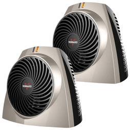 Two Vornado compact fan heaters with a sleek design, featuring a circular grille and black-and-metallic color scheme.