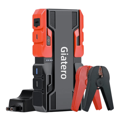 Portable jump starter with jumper cables and a charging adapter, featuring multiple USB ports and power indicators.