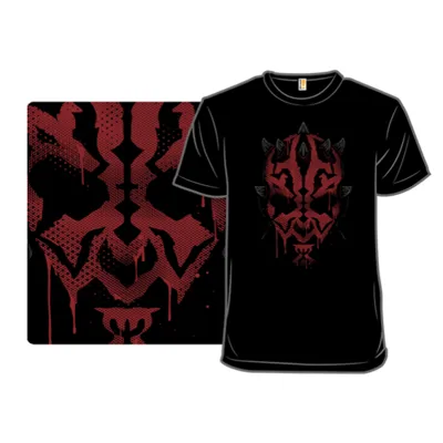 Black T-shirt featuring a bold red and black, ink-blot style graphic of a horned face with dripping effects.