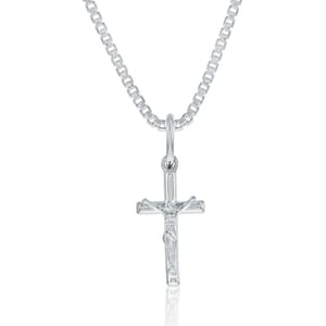 A silver crucifix pendant featuring a detailed depiction of Jesus on the cross, attached to a box chain.