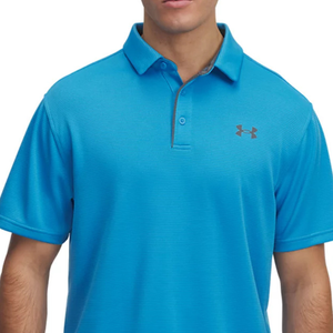 A blue Under Armour polo shirt with short sleeves and a button-up collar, featuring the brand logo on the chest.