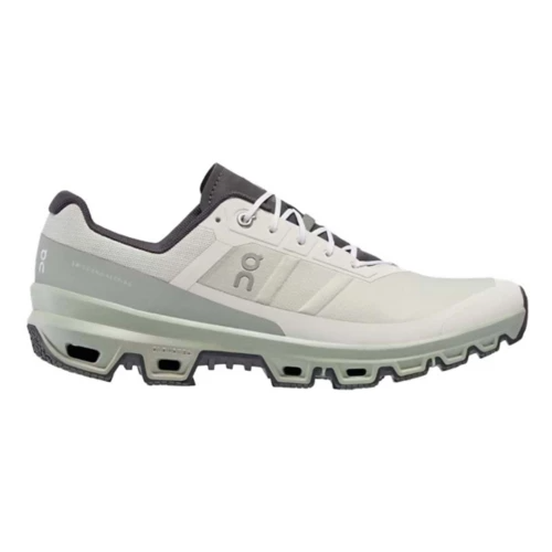 A white and gray athletic shoe with a structured sole featuring cut-out sections, designed for comfort and performance.