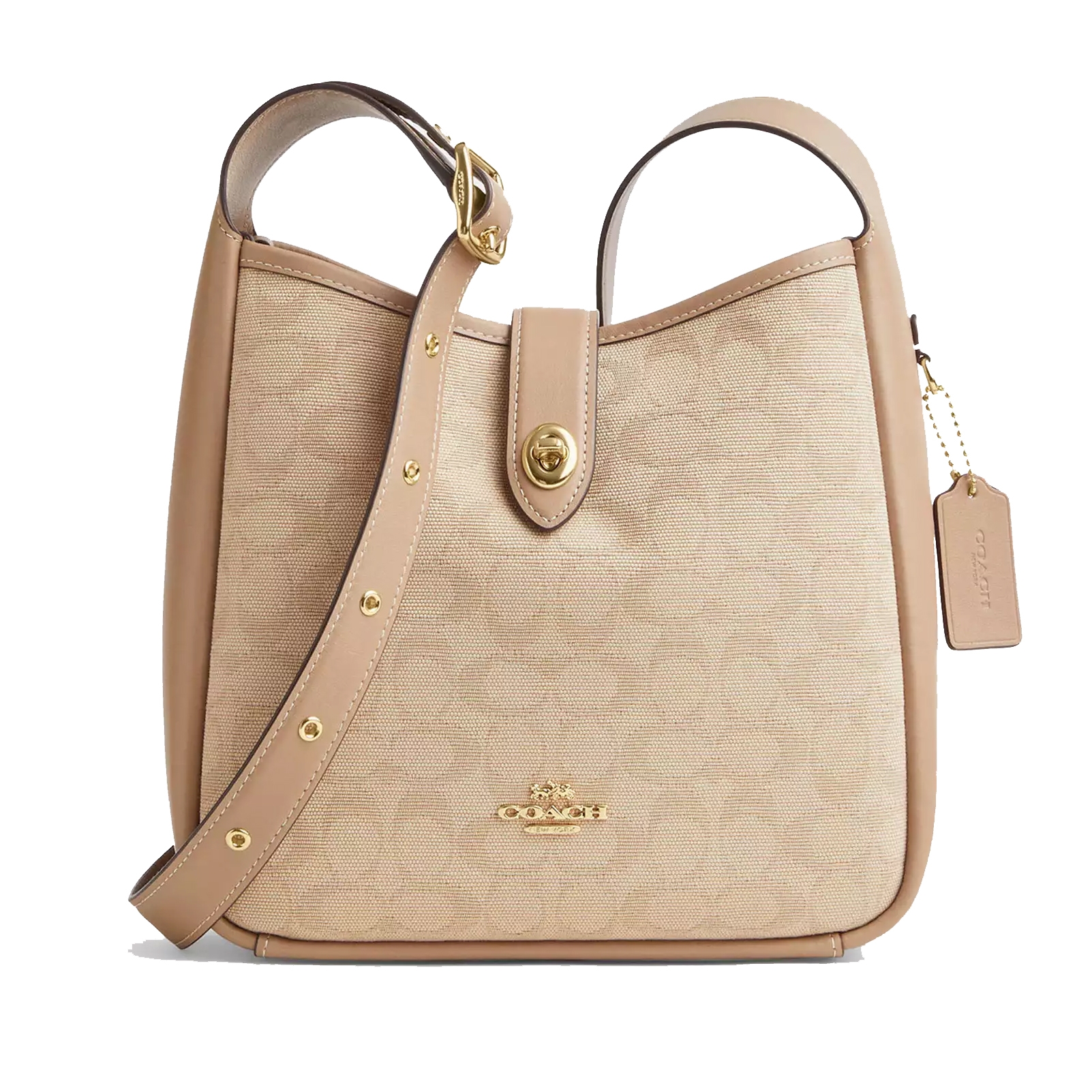 A beige Coach shoulder bag with a leather strap, gold-tone hardware, a turn-lock closure, and a signature tag.