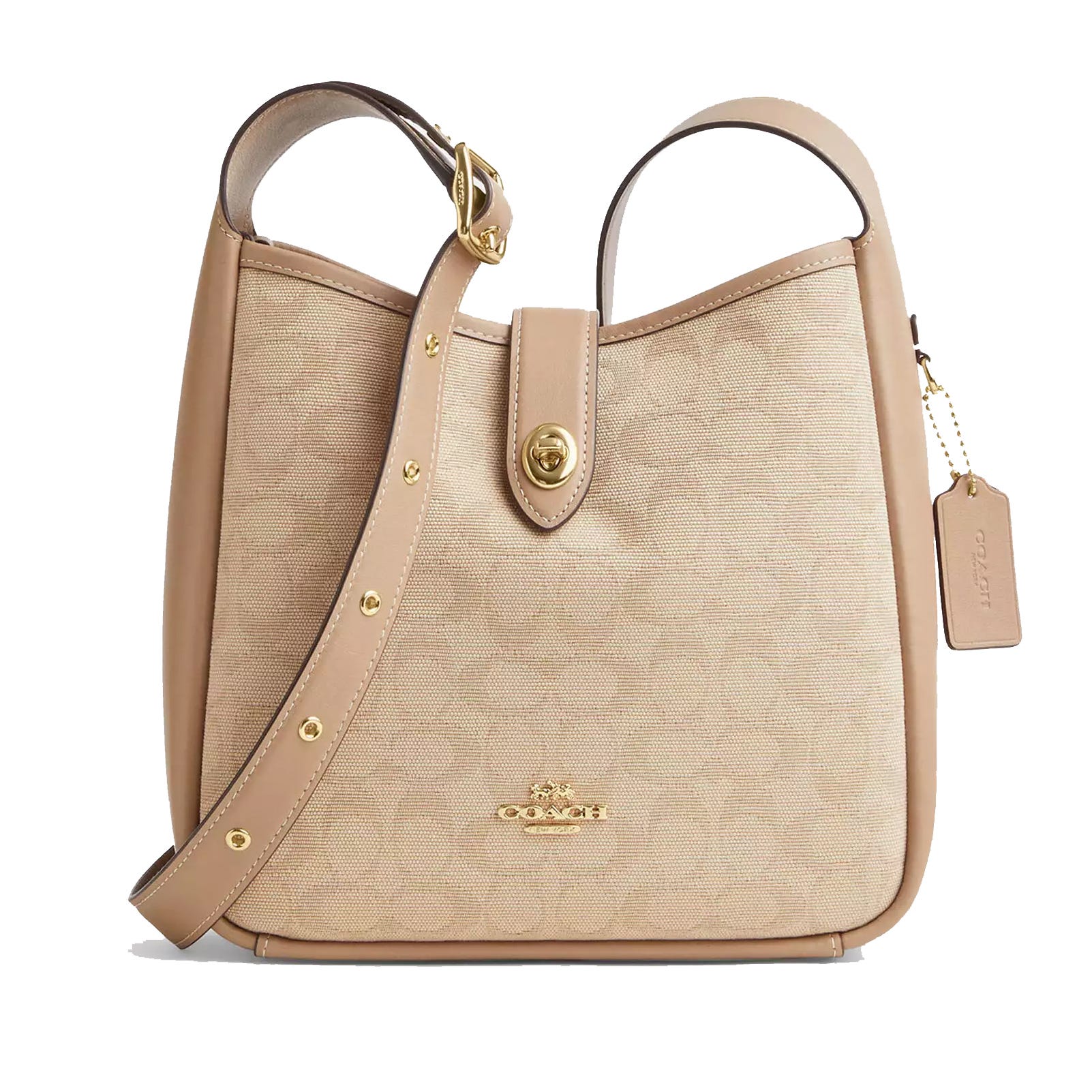 A beige Coach shoulder bag with a leather strap, gold-tone hardware, a turn-lock closure, and a signature tag.