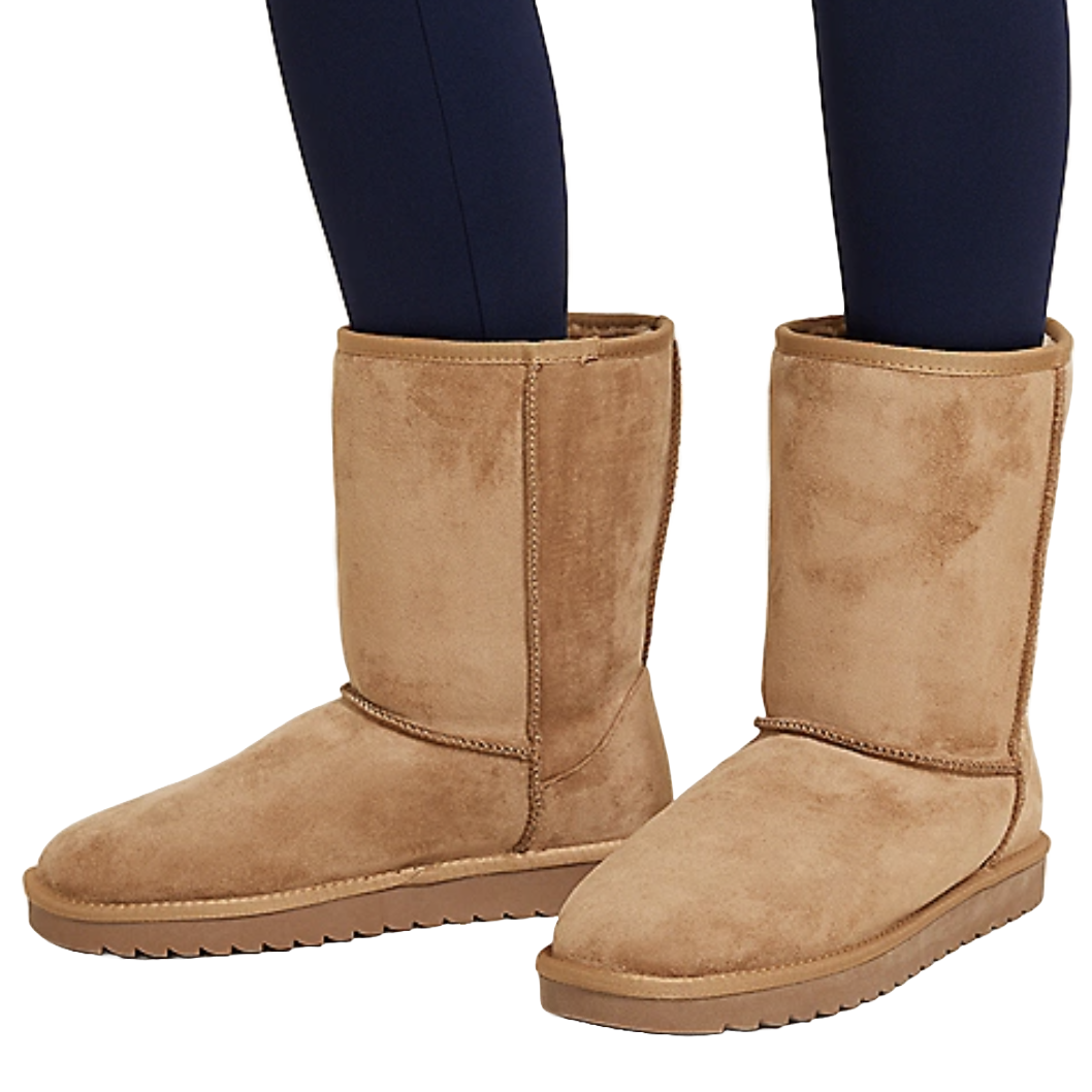 Tan suede mid-calf boots with a flat sole, commonly worn for comfort and warmth. Each boot has visible stitching and a rounded toe design.