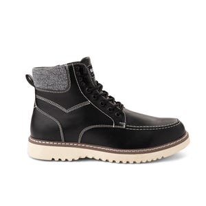 Black lace-up boot with tweed detailing at the top and a contrasting tan sole.