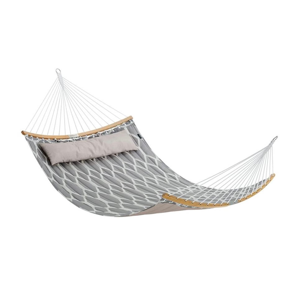 A gray quilted hammock with a pattern and a coordinating pillow, featuring wooden spreader bars on each end and a suspension system for hanging.