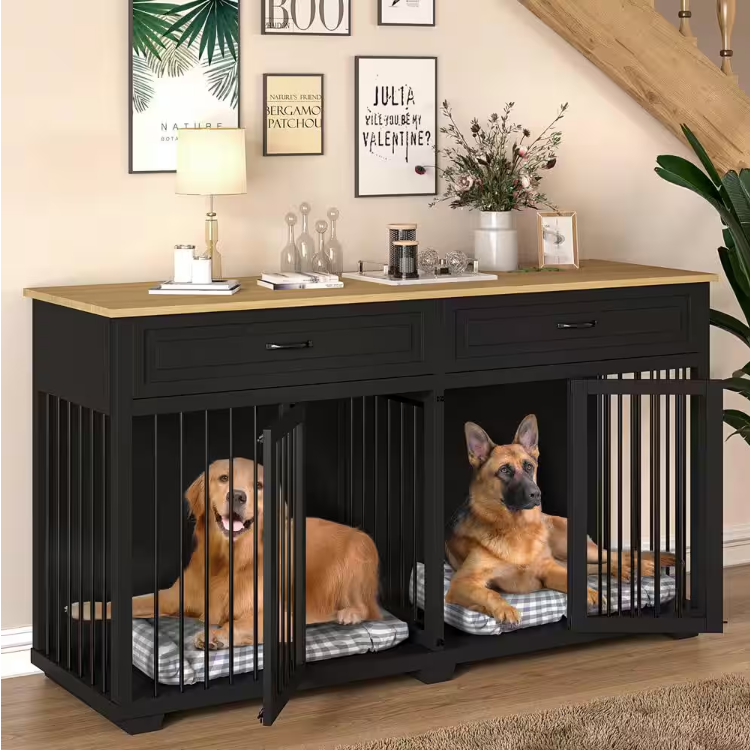 Black wooden accent storage cabinet with a light wood tabletop and two drawers, featuring two built-in dog kennels with open metal bars. The kennels house a Golden Retriever and a German Shepherd on cushioned beds. Wall art and decor adorn the tabletop and surrounding area.