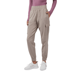Tan cargo joggers with an elastic waistband and cuffs, paired with a long-sleeve mauve top and white athletic sneakers.
