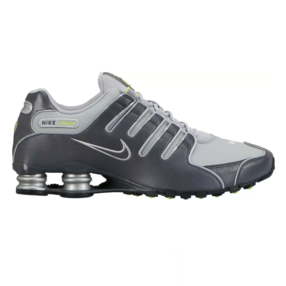 Nike Shox sneakers in gray and silver with a signature Swoosh and spring-based cushioning system for added comfort and support.