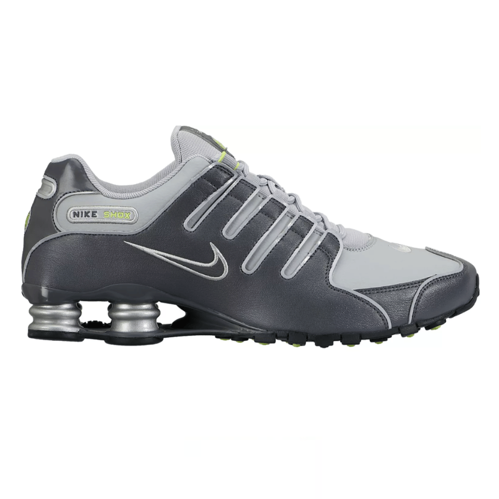 Nike Shox sneakers in gray and silver with a signature Swoosh and spring-based cushioning system for added comfort and support.