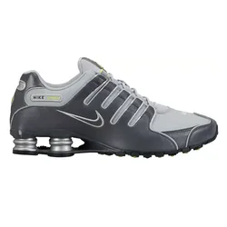 Nike Shox sneakers in gray and silver with a signature Swoosh and spring-based cushioning system for added comfort and support.