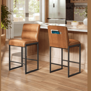 VASAGLE by SONGMICS HOME displays two brown leather bar stools with black metal frames in a kitchen setting, featuring a pocket on the backrest.