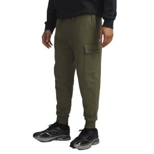 A person wearing olive green cargo joggers with a visible side pocket and black sneakers.